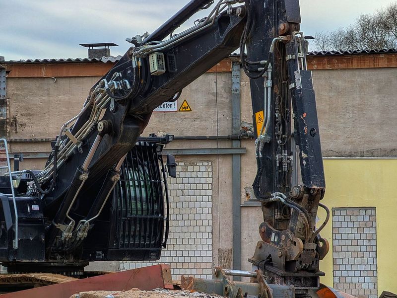 Excavator fitted with a demolition attachment