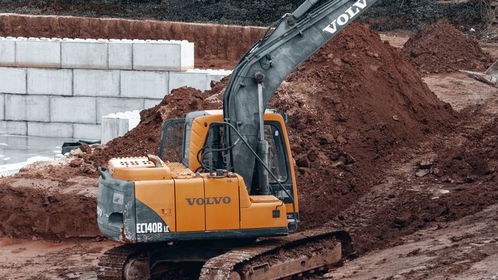 Excavator carrying out bulk earthworks