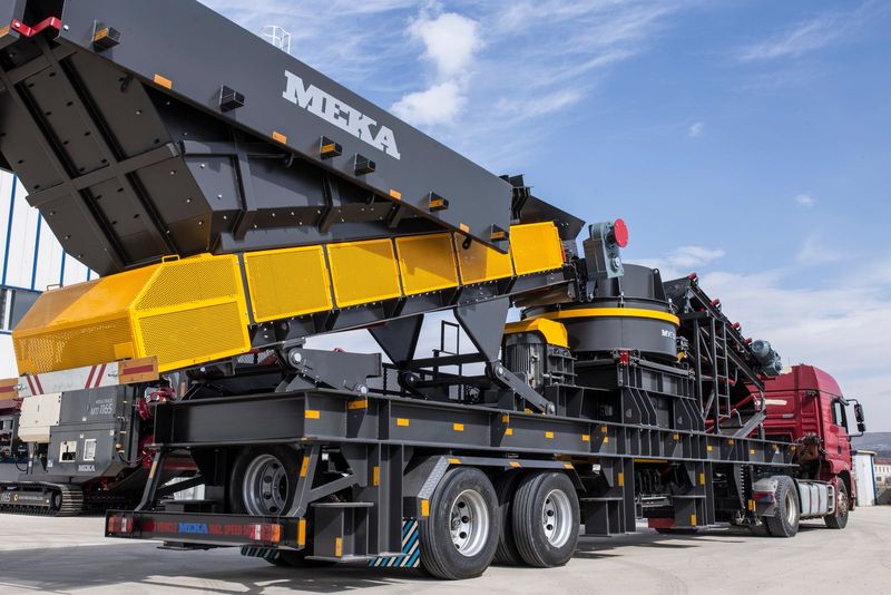 Crushing plant loaded on a low-loader for transport