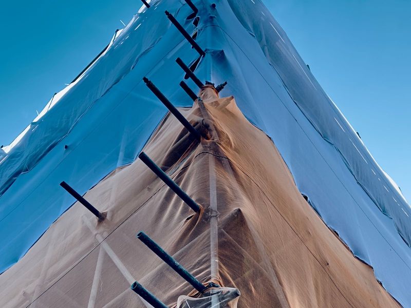Temporary roof sheeting over a building